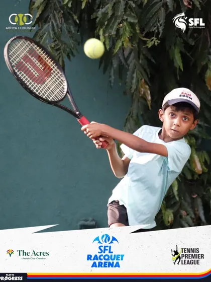 Eyes on the prize. This young competitor is captured mid-swing, hitting a forehand with precision during a Tennis Premier League event.