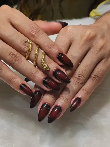 This look is all about dark, elegant drama. I created a seamless black-to-burgundy ombre effect on these long almond nails, finished with a high-gloss top coat for a sophisticated and edgy style.
