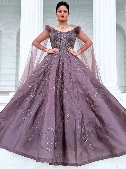 A powerful, full-frontal shot of the mauve ball gown, showcasing its grand silhouette.