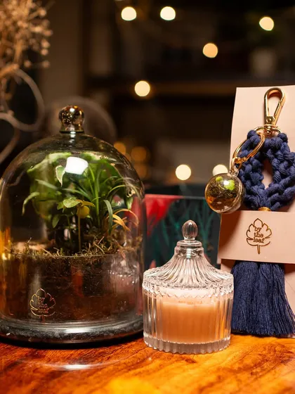 My Diwali gift box is a blend of nature and tranquility. It pairs a beautiful cloche terrarium with a scented candle and a handcrafted keychain, making it a mindful and eco-friendly gift choice.