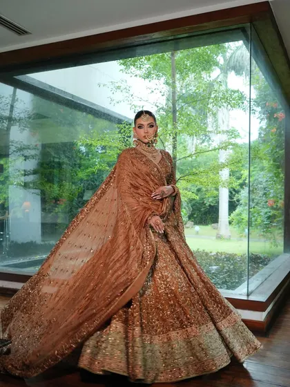 The full look against a modern backdrop, showing how traditional draping techniques can be styled for a contemporary feel.