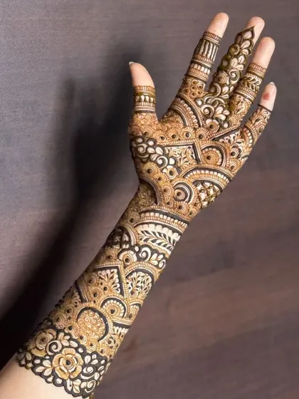 A high-contrast, sharp design that showcases the precision of my work. This full-arm henna combines fine lines, bold figures, and detailed shading for a truly impressive result.