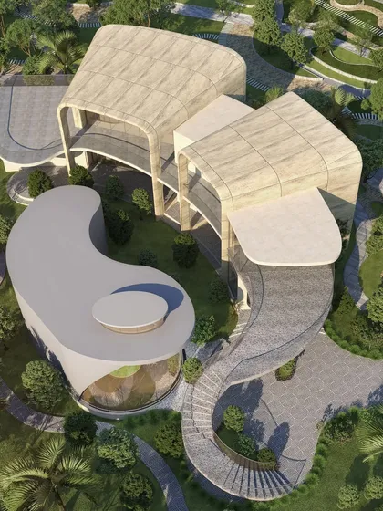 An aerial view of the CIPLA Museum and Dining Facility, showcasing its unique, flowing organic forms that interact with the surrounding green landscape.