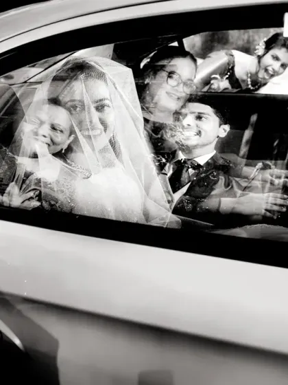 I love how the reflections and faces in the car window are layered in this black and white shot, telling a story of the journey to the chapel.