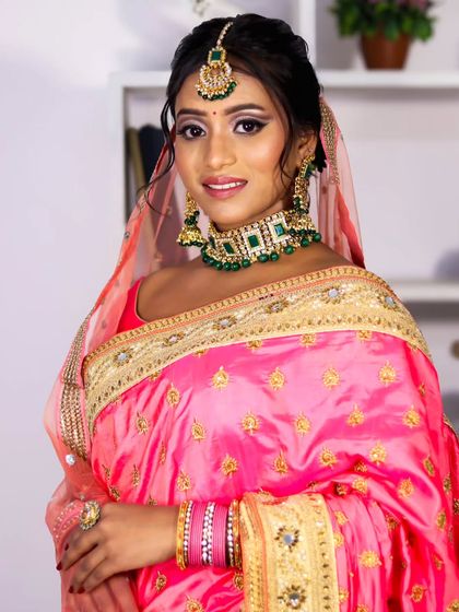 My goal is to make every bride look like the best version of herself. This reception look was all about elegance, with defined eyes and a beautiful pink saree.