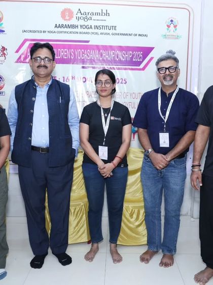 A group photo with our esteemed judges and chief guest for the children's yogasana championship. We are grateful for their expertise and guidance in making our event a success.