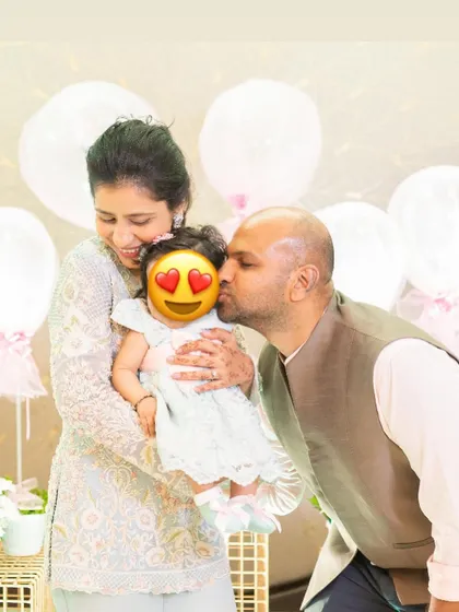 A precious family moment from my daughter Siya's celebration. My outfit was coordinated with hers, showing that even as a new mom, you can plan stylish and memorable looks for family events.