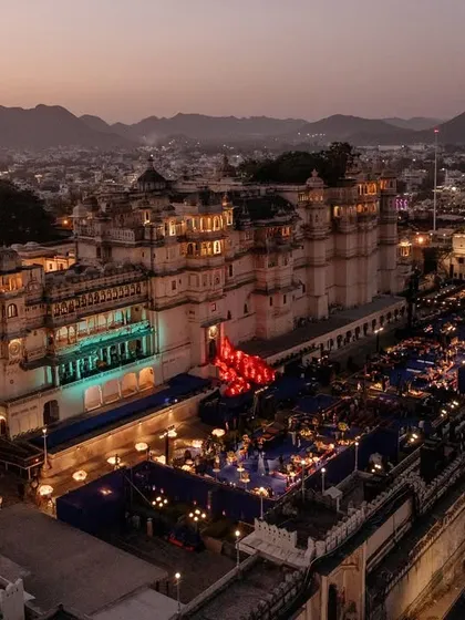 An aerial view of the Sangeet setup at Manek Chowk, Udaipur, showing the scale of the event against the historic city backdrop. We are experts in managing large-scale productions in complex, open-air venues.