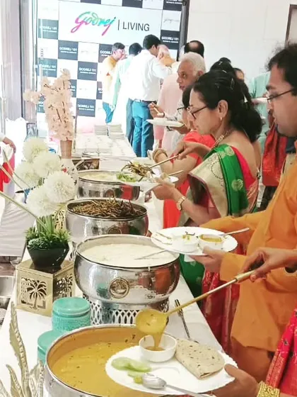 Happy guests enjoying a delicious spread at a corporate event for Godrej. My buffets are always generously stocked with a variety of dishes to please every palate.