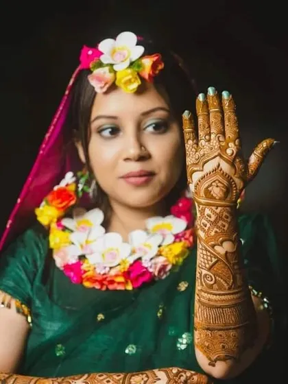 A close up of the same lovely bride, showing off the detail on one of her hands. The dark stain looks beautiful against her skin.