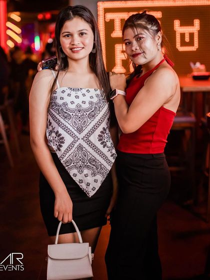 A stylish duo posing for the camera.