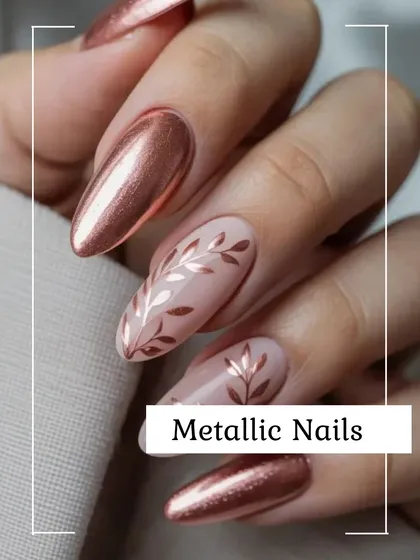 Make a statement with these stunning metallic nails. This design combines a high-shine rose gold chrome finish with intricate leafy nail art, creating a look that is both bold and elegant.