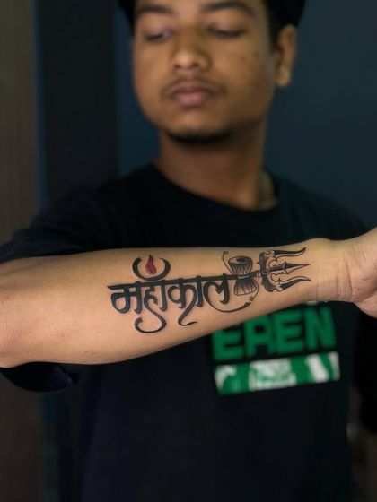 A client proudly showing their new Mahakal forearm tattoo. We make sure the size and placement are perfect for each individual.