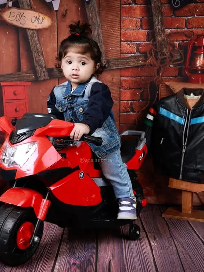 A full view of the biker garage set. The brick wall backdrop, tool shelves, and racing props create a realistic and fun environment for your little rebel.