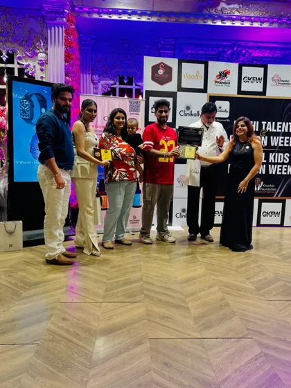 A team of participants receives their awards on stage. We celebrate both individual and group achievements at our events.