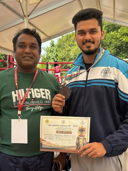 A moment with one of the officials after the boxing competition. Respect is a core value in all martial arts.