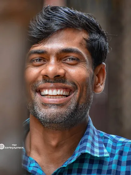 The best part of street photography is finding these moments of pure happiness. This man's wide, infectious smile is a perfect example of the positive energy you can find on any street corner.