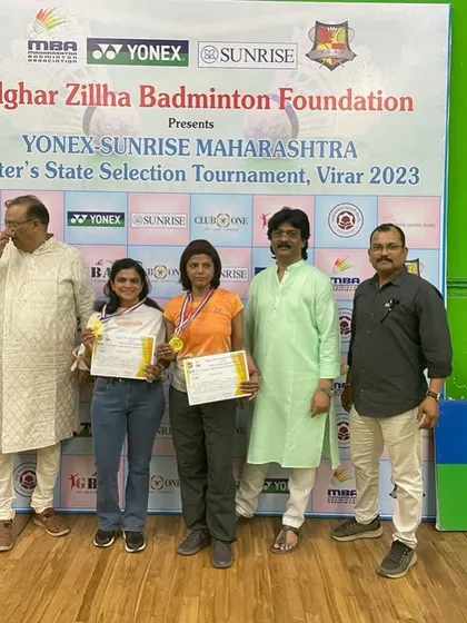 Bhagyalaxmi Kulkarni and her partner receiving their gold medals for the 35+ Women's Doubles category, securing their spot for the nationals.