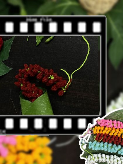 A creative flat-lay of my crochet gajras, showcasing the deep red version. These are perfect for festive occasions like weddings or pujas.