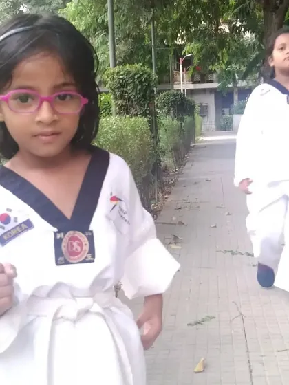 My little champ in her dobok (uniform). She is learning the basics of taekwondo and building a strong foundation.