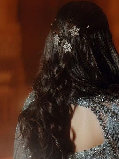 The snowflake-inspired hair accessories we chose for Nikita's sangeet. It was a subtle nod to the 'Frozen' vibe of her powder-blue outfit.