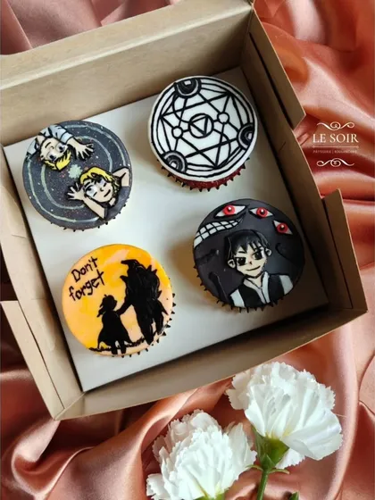 As a huge anime fan myself, I had the best time making these Fullmetal Alchemist themed cupcakes. Each topper is a hand-crafted fondant piece, featuring iconic characters and symbols from the series. If you have a favorite show, I can bring it to life.