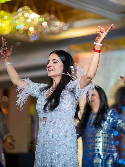 A beautiful moment from the bride's family performance. We love choreographing graceful and coordinated dances that bring everyone together.