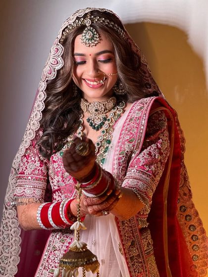 A close-up of the bride's joyful expression. The makeup is designed to look beautiful and feel comfortable, allowing her to fully enjoy her special day.