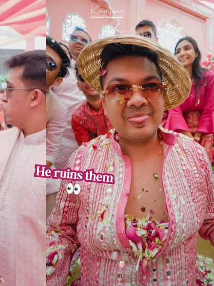 A playful moment where the groom gets covered in flowers and turmeric, fully embracing the fun and chaos of the Haldi ceremony.