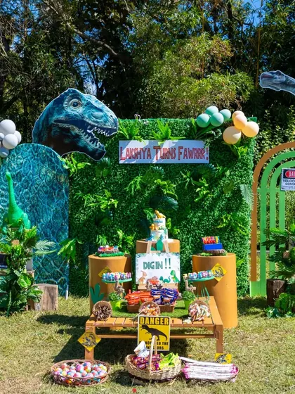 Welcome to a prehistoric adventure. For this dinosaur-themed birthday, I created a complete Jurassic scene with a vertical garden backdrop, custom signage, and a dessert table filled with themed treats to transport the little guests to another world.