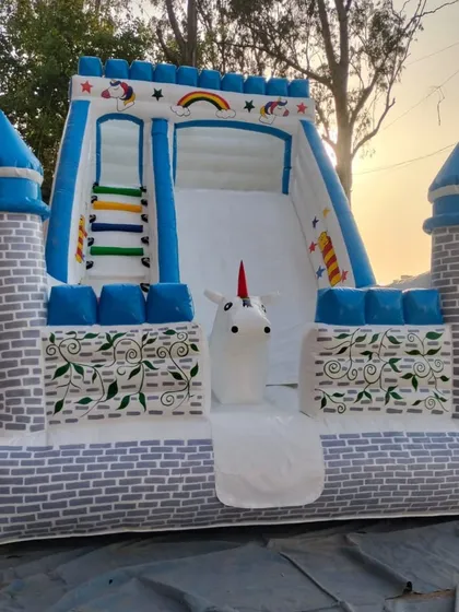 For all the unicorn fans, I made this special unicorn-themed bouncy castle. It has a beautiful white and blue castle design with a slide and a friendly unicorn right at the front. It’s perfect for a magical birthday party.