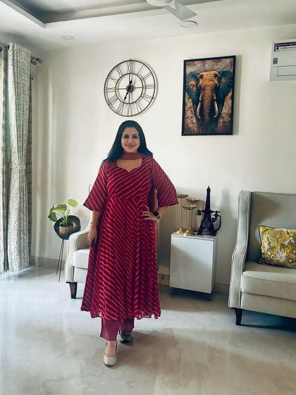 This red leheriya Anarkali suit is another one of my festive favorites. The bright color and flowy silhouette make it perfect for celebrations. It's comfortable enough to wear all day.