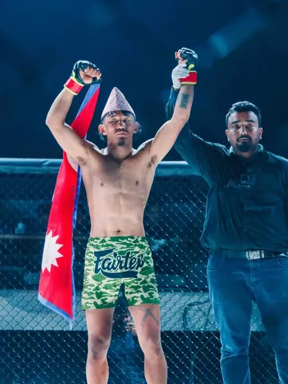 Raising the hand of a victorious fighter. As a referee, it's a privilege to be in the cage and be a part of these moments.