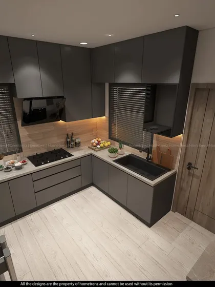 This angle shows the L-shaped layout and the seamless integration of the sink and cooktop.