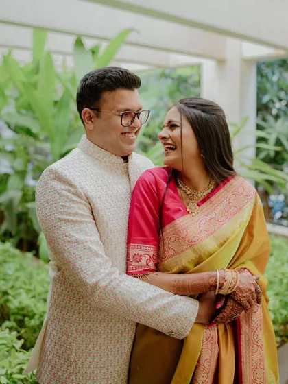Sudarshan and Naina sharing a joyful, natural laugh. My approach is to make you feel relaxed, so these real smiles come easily.
