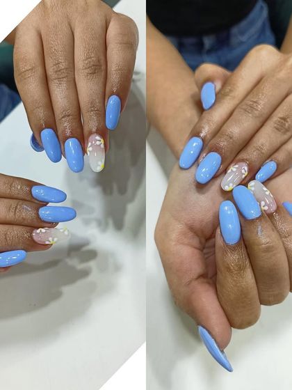 A lovely set of sky blue nails with accent nails featuring delicate, embedded heart glitter. This shows how I can incorporate different elements for a sweet and subtle design.