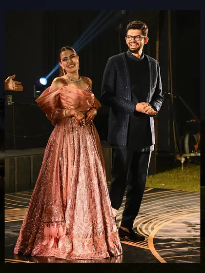 The happy couple, Nirja and Hitanshu, making their grand entrance at their Sangeet. Their smiles say it all.