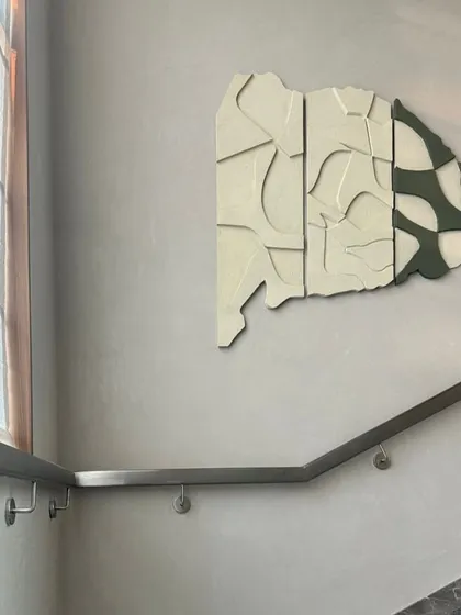 The finished modular artwork installed on a stairway wall in Hyderabad. The piece measures 41" x 41" and adds a dynamic, artistic element to the space.