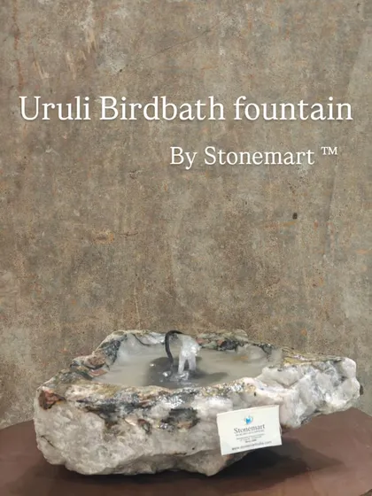 This natural stone piece serves as both a tabletop fountain and a birdbath. Its raw, organic shape brings a piece of nature indoors or to a small outdoor space.