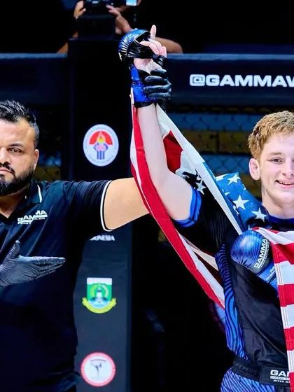 Raising the hand of a victorious fighter from the USA at the GAMMA World Championship. A moment of respect and sportsmanship on the global stage.