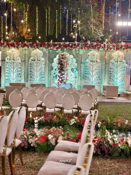 The aisle view of the Nikah ceremony, with floral arrangements lining the path and leading to the beautifully decorated main stage.