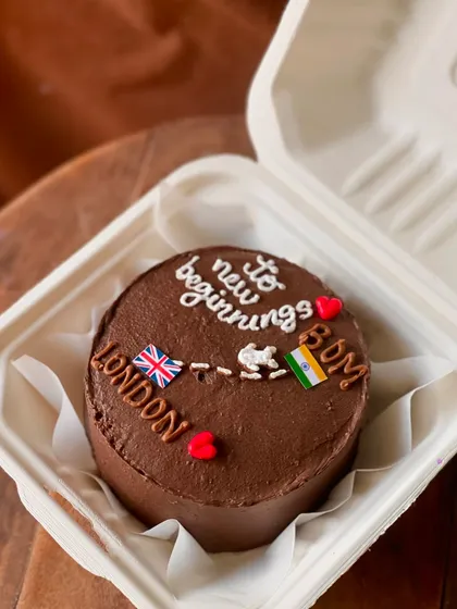 Wish someone well on their new journey with this farewell cake. The design shows a path from India to London, with the message "to new beginnings," perfect for someone moving abroad.
