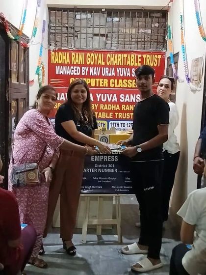 Another shot of me distributing educational supplies. Every child deserves the opportunity to learn and grow, and I am happy to contribute in any way I can.