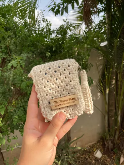 This is our two-sectioned mini wallet, perfect for keeping your cash and cards separate. It's a compact and stylish alternative to a bulky purse.