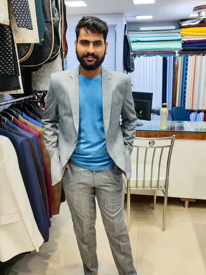 A collection of our clients in their custom-tailored formal suits, showcasing different fabrics and fits for various professional and formal occasions.