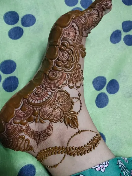 A beautiful foot design in progress, showing how the intricate patterns are carefully built up to create a stunning final piece.