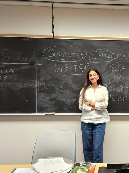 Standing in front of the blackboard after a class at the University of Toronto. This photo represents a full-circle moment for me, from dreaming of being a student here to sharing my passion for writing with others in the same space.