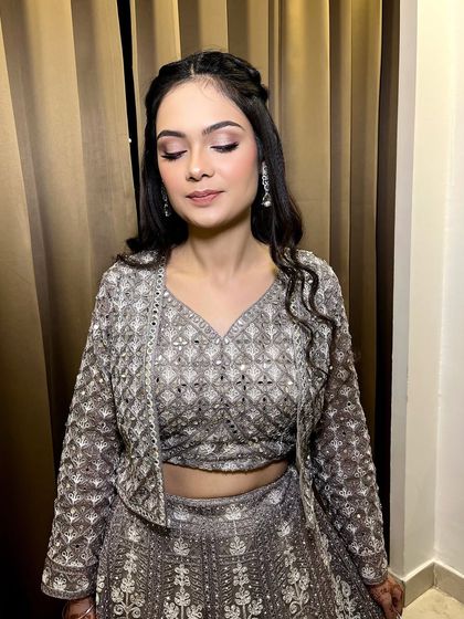 The prettiest 'dulhan ki behen'. We created a very soft shimmer eye with a pink liner, paired with a skin-finish base and nude lips for a fresh and modern look.