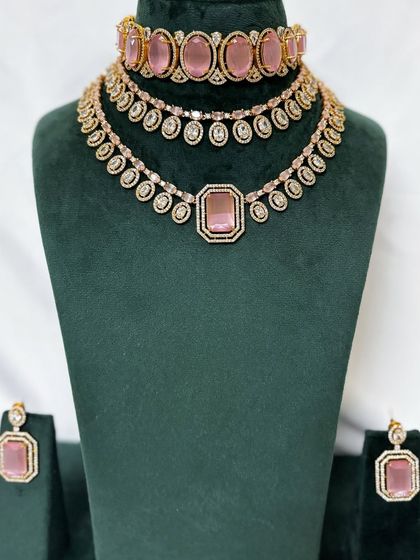 A full view of the pink stone necklace set with matching earrings. This is a beautiful rental option for a sangeet or reception.