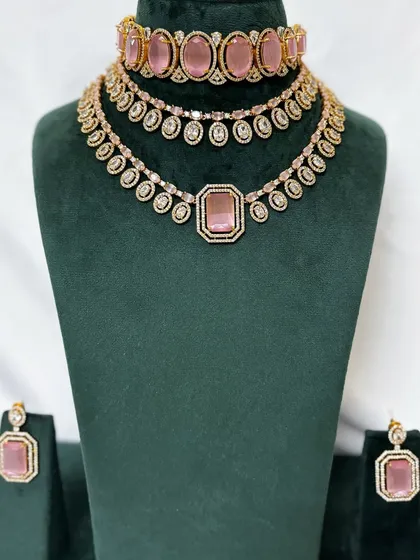 A full view of the pink stone necklace set with matching earrings. This is a beautiful rental option for a sangeet or reception.